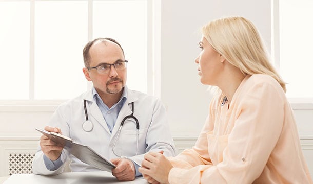 Doctor-discussing-artificial-urinary-sphincter
