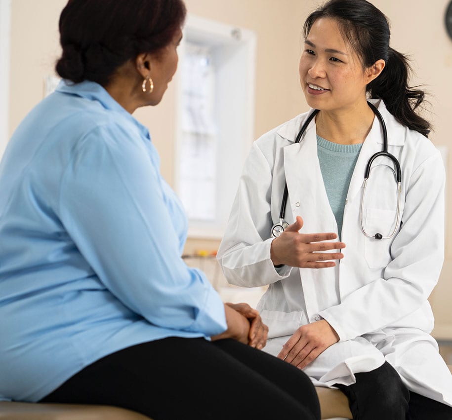 Female doctor speaking to patient about upcoming Blue Light Cystoscopy procedure