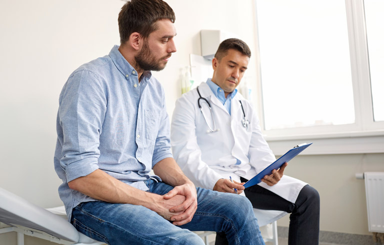 Doctor-examining-patient-for-male-infertility