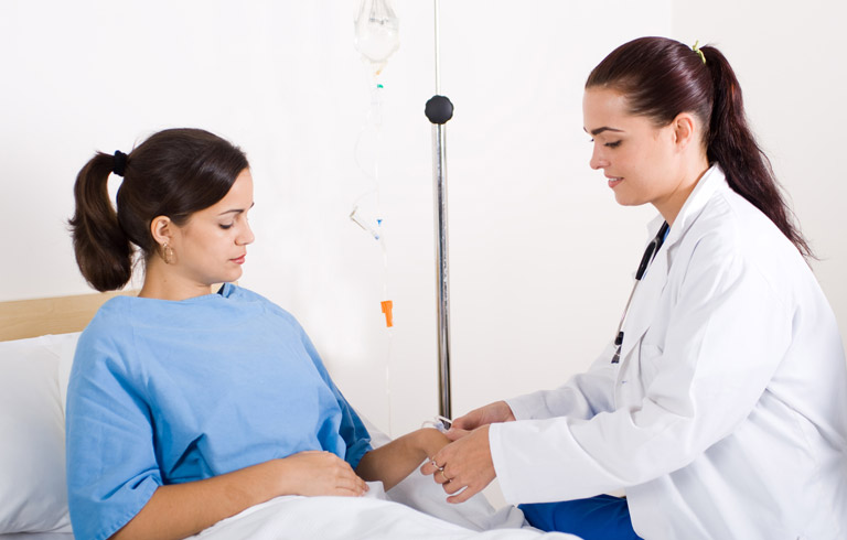 Doctor-helping-patient-after-genitourinary-fistula-repair