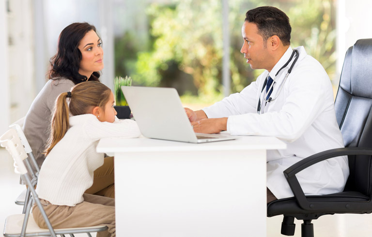 pediatric-urologist-consulting-mother-and-child